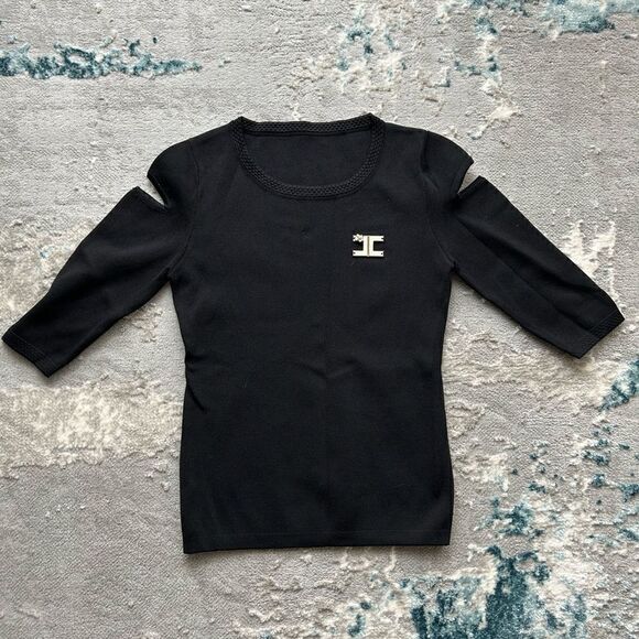 Stretchy shirt. Underarm width 14 when unstratched. Length 29 - Picture 1 of 3